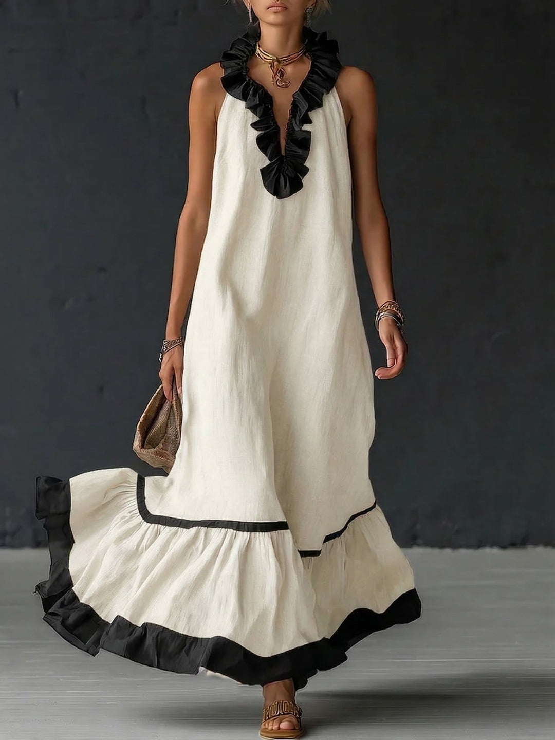 Woman wearing sleeveless color block maxi dress with ruffles
