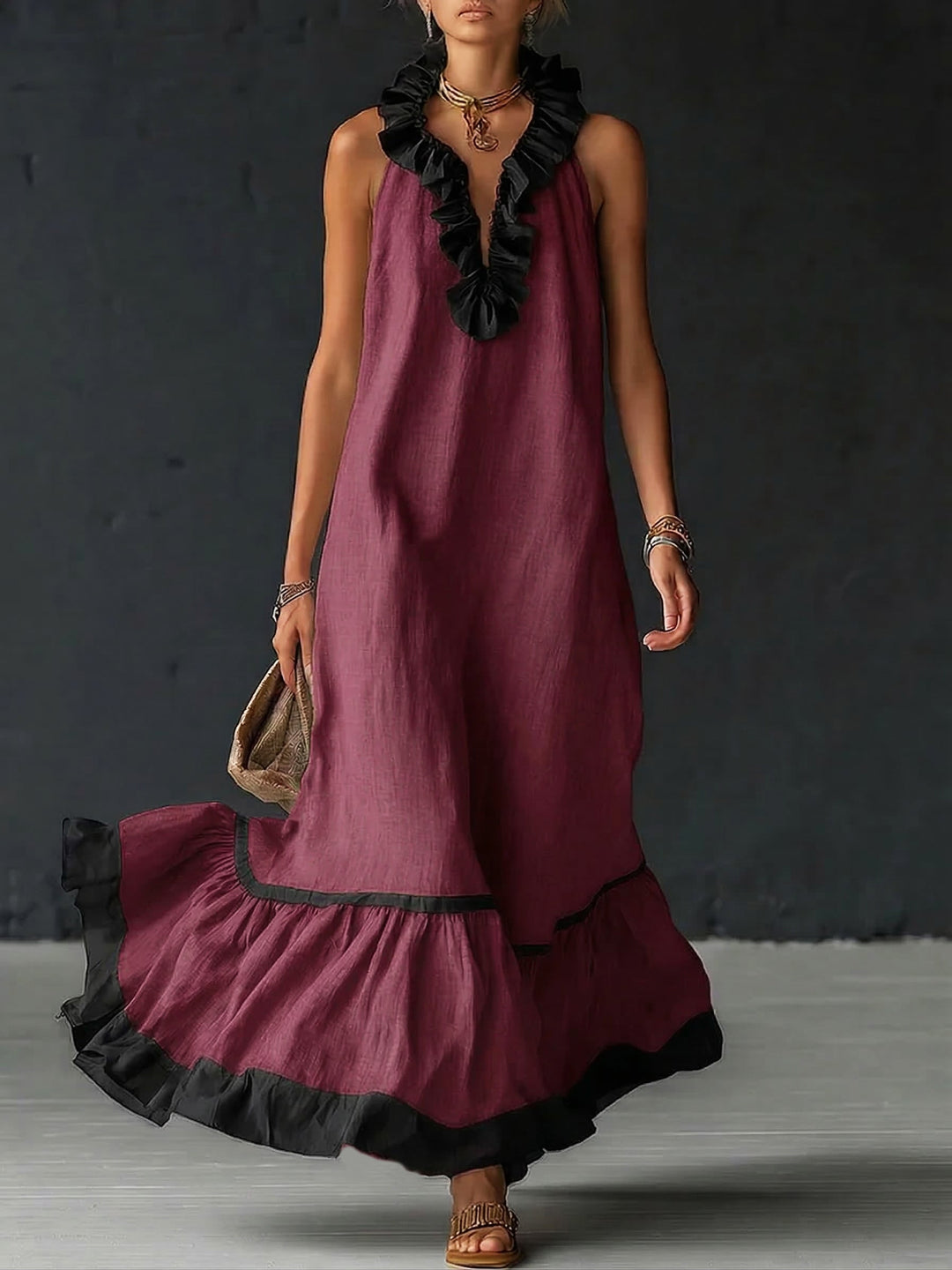 Woman wearing sleeveless color block maxi dress with ruffles