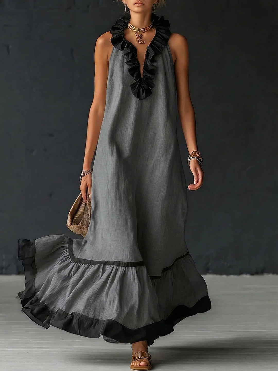 Woman wearing sleeveless color block maxi dress with ruffles
