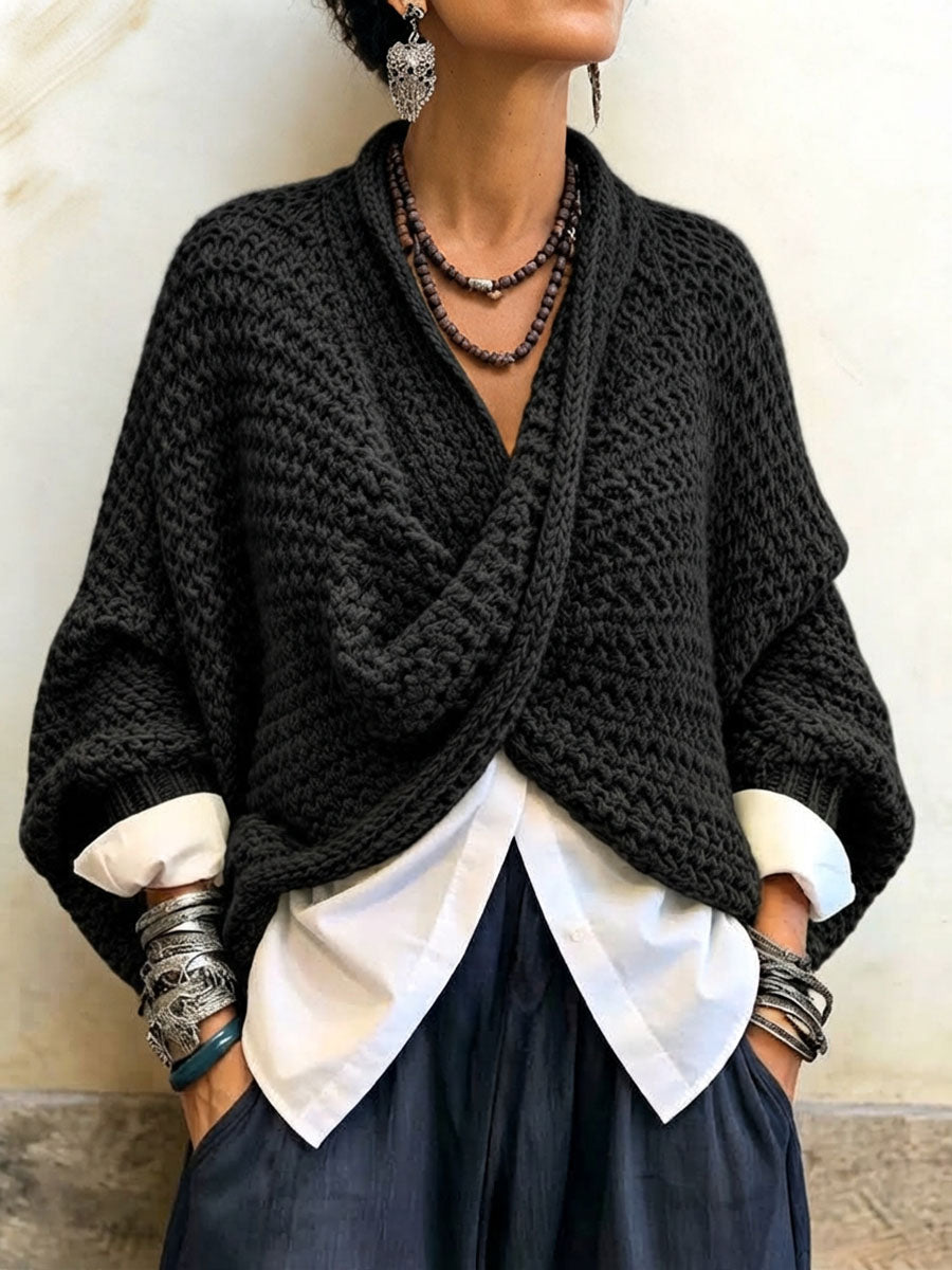 Woman wearing crossover V-neck batwing sleeve sweater