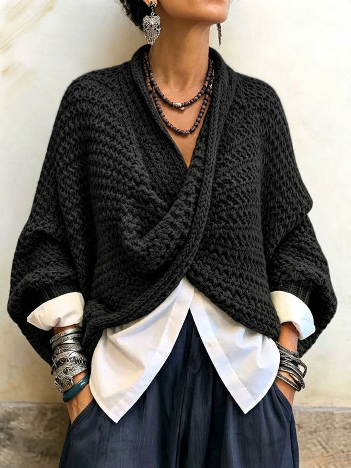 Woman wearing crossover V-neck batwing sleeve sweater