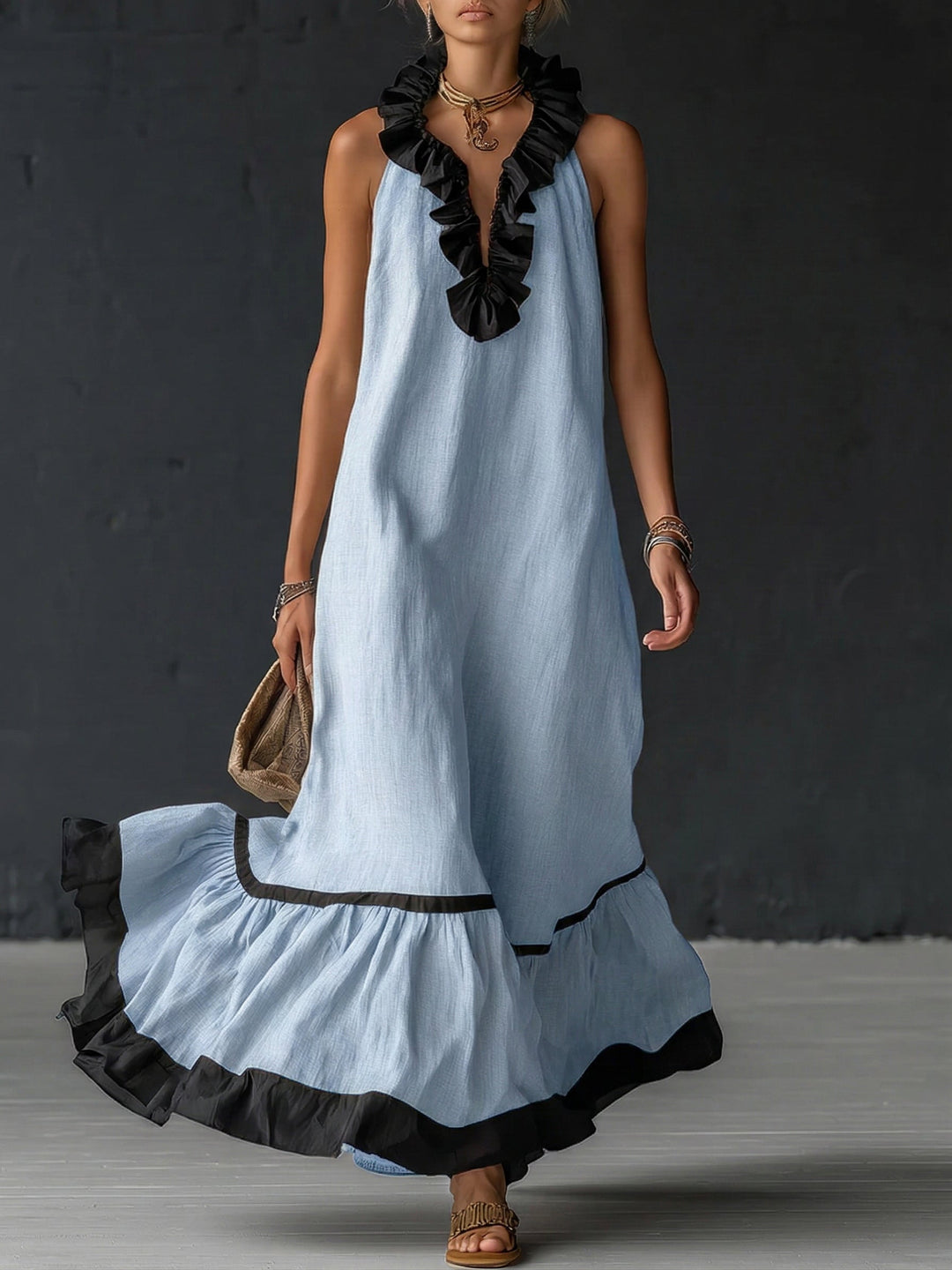 Woman wearing sleeveless color block maxi dress with ruffles