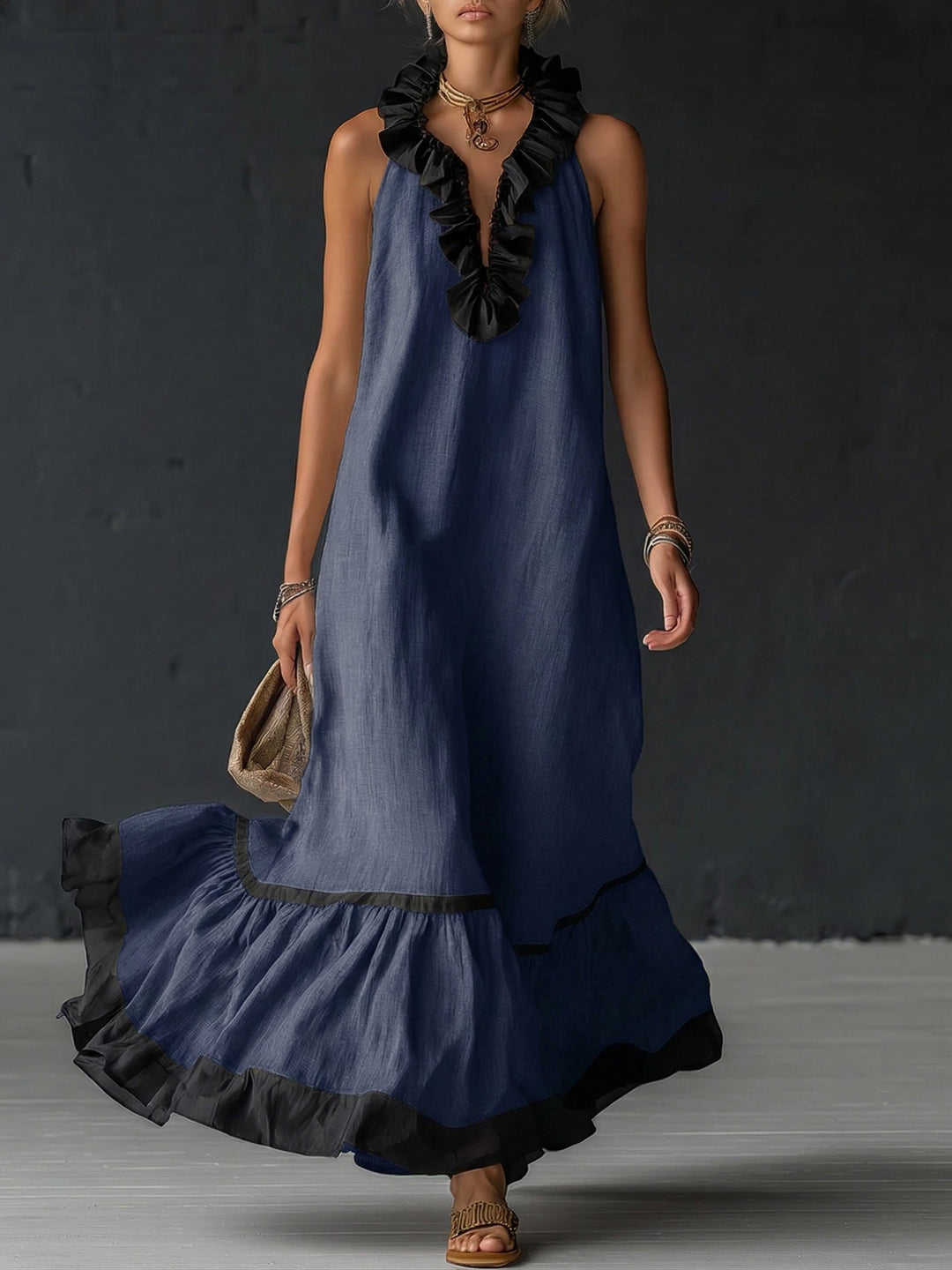 Woman wearing sleeveless color block maxi dress with ruffles