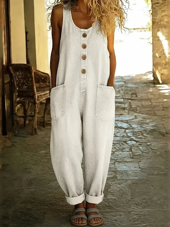 Woman wearing a wide leg oversized jumpsuit with adjustable straps
