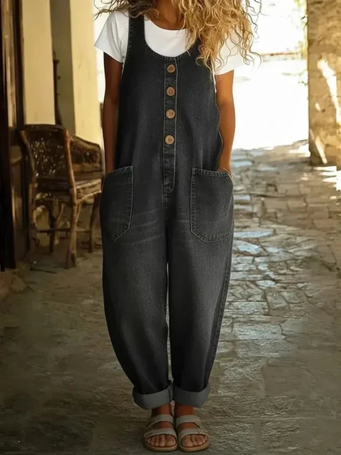 Woman wearing a wide leg oversized jumpsuit with adjustable straps