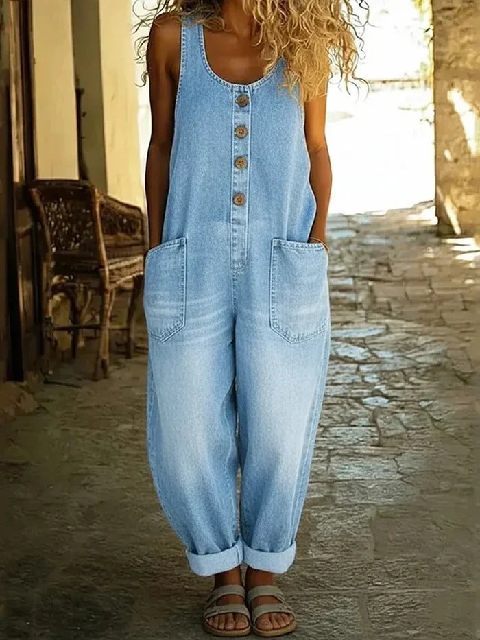 Woman wearing a wide leg oversized jumpsuit with adjustable straps