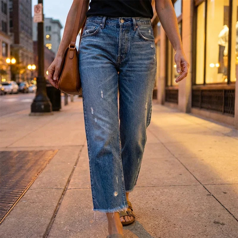 Woman wearing cropped straight leg jeans with light faded wash