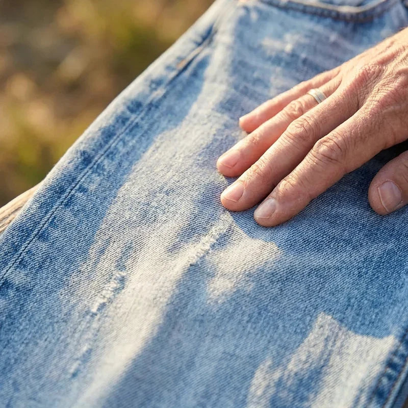 Woman wearing cropped straight leg jeans with light faded wash