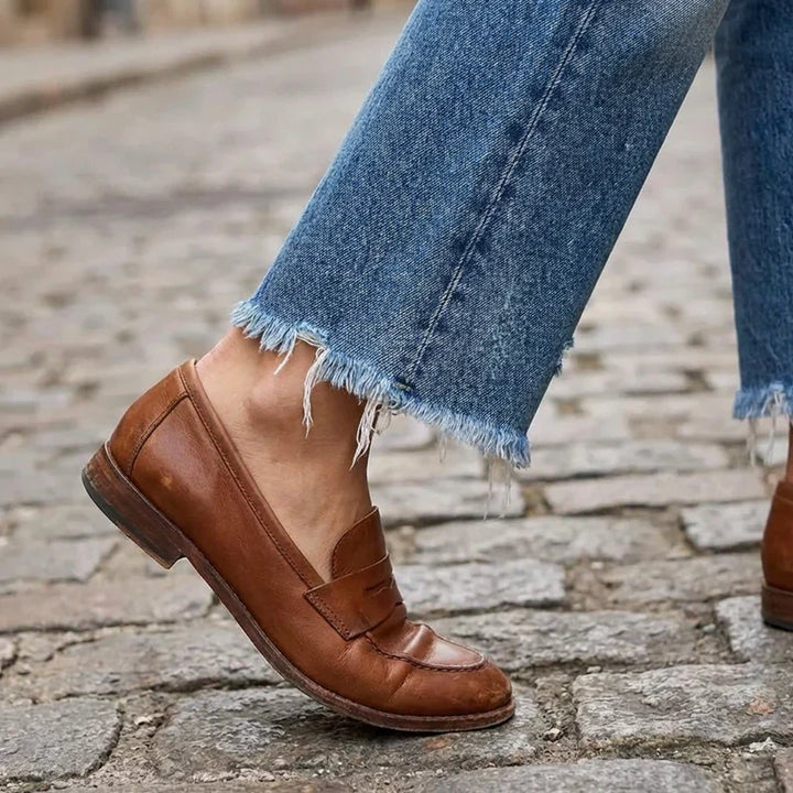 Woman wearing cropped straight leg jeans with light faded wash