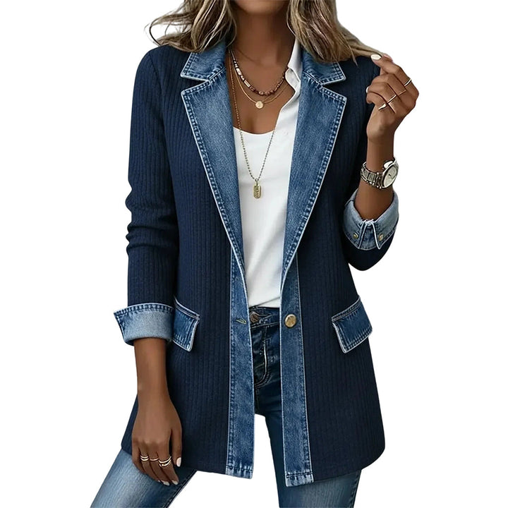Woman wearing ribbed knit and denim patchwork jacket outdoors